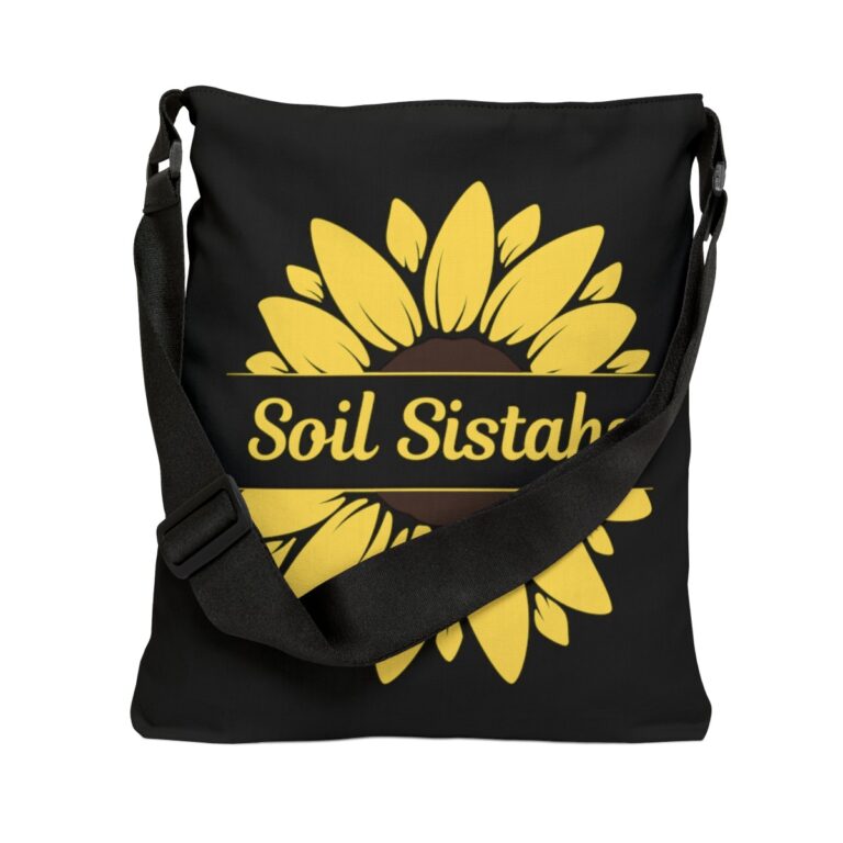 Black colored adjustable tote bag with a yellow sunflower and the term "Soil Sistahs" in pale yellow.